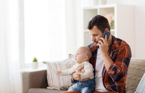 Father with baby in mortgage stress.
